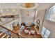 Bright, two-story living room with hardwood floors, large windows, fireplace and elegant chandelier at 426 Lanesborough Dr, Marietta, GA 30064