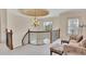 Upstairs landing featuring an elegant chandelier, iron railing and seating at 426 Lanesborough Dr, Marietta, GA 30064