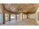 Wide covered patio with brick arches, ceiling fans, and direct access to the outdoors at 426 Lanesborough Dr, Marietta, GA 30064