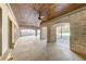 Spacious covered patio with brick pillars and wooden ceiling and a large backyard area at 426 Lanesborough Dr, Marietta, GA 30064