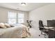 Cozy bedroom with a bed, exercise bike, and desk area, perfect for work or relaxation at 1100 N North Village Drive Dr, Decatur, GA 30032