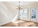 Bright dining area featuring hardwood floors, modern chandelier and large windows at 1100 N North Village Drive Dr, Decatur, GA 30032