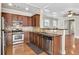 Well-equipped kitchen featuring stainless steel appliances, granite countertops, and ample cabinetry at 1100 N North Village Drive Dr, Decatur, GA 30032