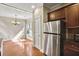 A kitchen featuring stainless steel appliances and granite countertops, adjacent to a dining area at 1100 N North Village Drive Dr, Decatur, GA 30032