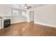 Bright living room with a fireplace, hardwood floors, and a coffered ceiling at 1100 N North Village Drive Dr, Decatur, GA 30032