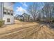 View of backyard and the back side of the property showing ample yard space at 237 Elmbrook Ln, Canton, GA 30114