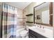 Full bathroom with tub and shower combo and decorative tile accents at 237 Elmbrook Ln, Canton, GA 30114