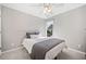 Neutral bedroom with plush carpet, ceiling fan, and natural light at 237 Elmbrook Ln, Canton, GA 30114