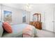 Bedroom features natural light, wood dresser, and plush carpet at 237 Elmbrook Ln, Canton, GA 30114