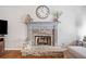 Living room fireplace with stone surround, mantel, and wooden details at 237 Elmbrook Ln, Canton, GA 30114