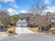 Charming two-story home with a well-manicured lawn and a two-car garage at 237 Elmbrook Ln, Canton, GA 30114