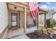 Charming front porch with stone accents, rocking chairs, and a view of the front yard at 237 Elmbrook Ln, Canton, GA 30114