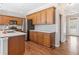 Well-lit kitchen featuring wood cabinets, stainless appliances, and marble countertops at 237 Elmbrook Ln, Canton, GA 30114