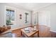 Bright living room featuring hardwood floors, large windows, and neutral decor at 237 Elmbrook Ln, Canton, GA 30114