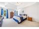 Spacious main bedroom featuring tray ceilings, plush carpet, and blue accents at 237 Elmbrook Ln, Canton, GA 30114