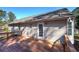 Rear exterior of home shows a deck with natural siding and direct access to backyard at 26 Wey Bridge Ct, White, GA 30184