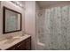 Bathroom with vanity, mirror, and tub/shower with curtain at 26 Wey Bridge Ct, White, GA 30184