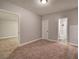 Cozy bedroom featuring neutral paint, plush carpet and a ceiling light at 26 Wey Bridge Ct, White, GA 30184