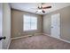 Bedroom with neutral walls, carpeted floor, and window at 26 Wey Bridge Ct, White, GA 30184