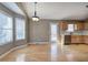 Bright dining area featuring hardwood floors and a door to the backyard at 26 Wey Bridge Ct, White, GA 30184