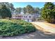 Inviting home with a spacious front yard, attached two-car garage and a welcoming front porch at 26 Wey Bridge Ct, White, GA 30184