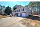 Charming home with a covered porch and a driveway leading to a two-car garage at 26 Wey Bridge Ct, White, GA 30184