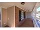 Inviting front porch featuring brick accents, white railings, and a charming outdoor space at 26 Wey Bridge Ct, White, GA 30184