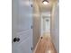 Hallway with hardwood floors and ample closet space at 26 Wey Bridge Ct, White, GA 30184