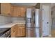 Kitchen featuring stainless steel refrigerator and plentiful cabinet storage at 26 Wey Bridge Ct, White, GA 30184