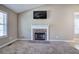 Cozy living room with a stone fireplace and neutral tones at 26 Wey Bridge Ct, White, GA 30184