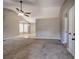 Spacious living room with a ceiling fan and large windows for natural light at 26 Wey Bridge Ct, White, GA 30184