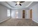 Spacious main bedroom with trey ceilings and two doorways leading to bathrooms and walk-in closets at 26 Wey Bridge Ct, White, GA 30184