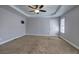 Spacious main bedroom featuring trey ceiling, fan and large windows at 26 Wey Bridge Ct, White, GA 30184