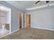 Spacious main bedroom featuring a trey ceiling and two doorways leading to bathrooms and walk-in closets at 26 Wey Bridge Ct, White, GA 30184