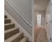 Carpeted staircase with white railing, leading to the upper level of the home at 26 Wey Bridge Ct, White, GA 30184