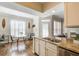 Cozy dining area with natural light, plantation shutters, and a view of the kitchen at 3777 Peachtree Ne Rd # 722, Brookhaven, GA 30319