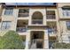 Multi-level condo building featuring balconies with decorative railings and neutral-toned facade at 3777 Peachtree Ne Rd # 722, Brookhaven, GA 30319