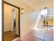 Hallway with wooden floors leading to stairs, showing a light and open entryway at 3777 Peachtree Ne Rd # 722, Brookhaven, GA 30319