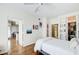 Bright main bedroom featuring hardwood floors, a ceiling fan, and a closet with custom shelving at 3777 Peachtree Ne Rd # 722, Brookhaven, GA 30319