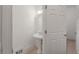 Clean bathroom featuring a pedestal sink and classic fixtures at 5080 Riverlake Dr, Peachtree Corners, GA 30097