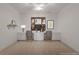 Bedroom designed with built-in desks and cabinets, accompanied by shelving, decor, and two comfortable chairs at 5080 Riverlake Dr, Peachtree Corners, GA 30097