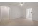 Bonus room with neutral carpet, a large double door closet, and a double hung window offering natural light at 5080 Riverlake Dr, Peachtree Corners, GA 30097