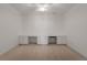 Spacious bonus room with built-in cabinets, carpet, and recessed lighting at 5080 Riverlake Dr, Peachtree Corners, GA 30097