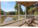 Inviting deck with lake views, decorative railing and ample space for outdoor seating at 5080 Riverlake Dr, Peachtree Corners, GA 30097