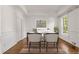 Bright home office featuring a large window, traditional molding, and hardwood floors at 5080 Riverlake Dr, Peachtree Corners, GA 30097