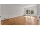 Bright room with hardwood floors and large windows offering plenty of natural light at 5080 Riverlake Dr, Peachtree Corners, GA 30097