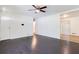 Open living space features dark wood floors and neutral walls, allowing for versatile decorating options at 8169 Kendrick Rd, Jonesboro, GA 30238