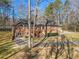 Charming brick home featuring a well-manicured lawn, mature trees, paved drive and a possible hot tub at 3107 Hammock Creek Ct, Conyers, GA 30012