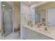 Bright bathroom with double sinks, a large mirror, and a glass shower at 3636 Habersham Rd # 2307, Atlanta, GA 30305