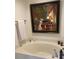 A soaking tub is the centerpiece in this modern, clean bathroom at 3636 Habersham Rd # 2307, Atlanta, GA 30305